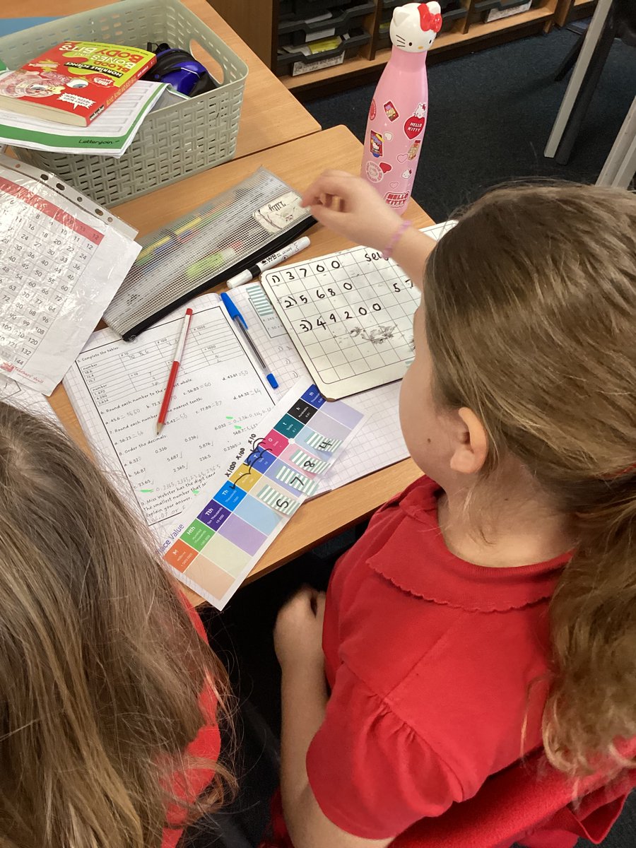 BMJClassof25's tweet photo. Today in Y5, we used place value charts and jazzy, mini post-it notes to investigate multiplying decimals by 10, 100 and 1000. Safe to say we did some #headhurtlearning and we all #relishthechallenge at #BMJ https://t.co/JkByEKDjYn