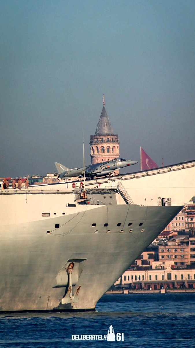 A fantastic view of Juan Carlos I, the Spanish amphibious assault ship, visiting Istanbul (Circa 2011). The EAV-8B+ Harrier stands out against the backdrop of the 676-year-old Galata Tower. #avgeeks #aviation #aviationdaily #aviationlovers #Spain