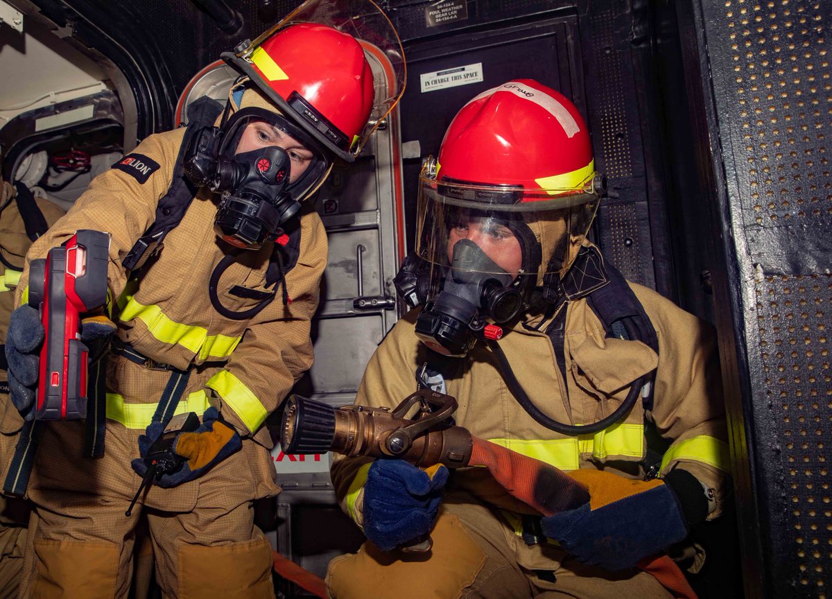 Enhancing Readiness 🚨🧑‍🚒🧯 A Damage Controlman operates a naval firefighting thermal imager as a Boatswain's Mate combats a simulated fire on the bridge aboard USS Gravely (DDG 107) during a general quarters drill. 📸: Petty Officer 1st Class Jonathan Word #Warfighting #Readiness