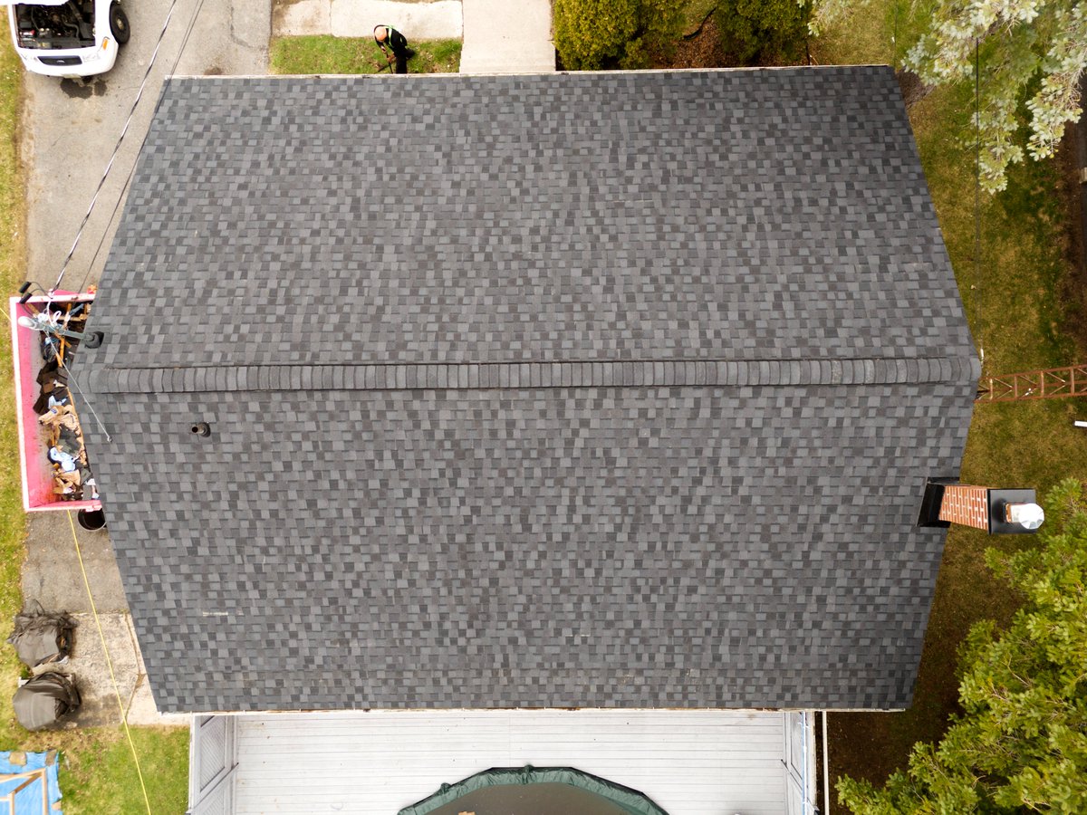 AquilaRoofing's tweet photo. The first full roof of the year completed by the Aquila Roofing Team! This house in Smiths Falls was completed over two days and included installation of new intake-vents and ridge-vents. The Shingle System is CertainTeed Landmark PRO in the colour MaxDef Moire Black! https://t.co/rmQ3Uu1Sp0