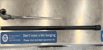 TSA's tweet photo. This wasn’t a step in the right direction, cane you believe someone tried sneaking this through @EWRairport? Swords are not allowed to fly. Check all items before flying, prevent any unwanted delays. Know what you can pack, check out: https://t.co/S3mtG5xIAT
#ProhibitedItemsWeek https://t.co/E0GM1pWMUa