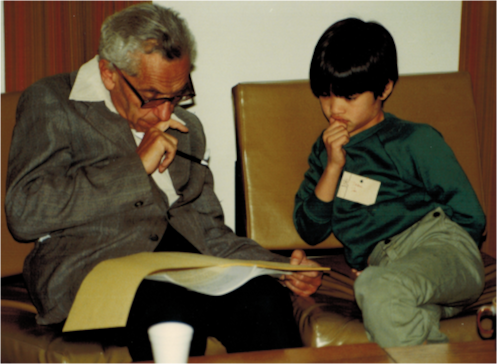 This is a famous picture of Erdős and a young Terence Tao in 1985 discussing mathematics. I recently learnt what they were talking about.
