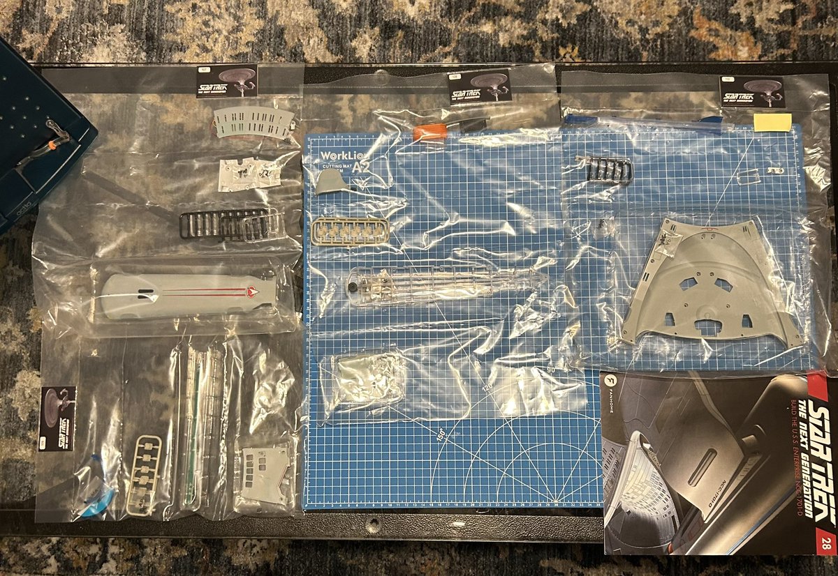 Jmrog84's tweet photo. Round 28: Kits 107 through 110 of my Enterprise D build. Last pieces of the bottom of the saucer section are coming together and we begin assembling the other warp nacelle. #starfleetbuilders @divine_treasury @TrekGeeks @FanhomeUS https://t.co/r0Z8Ekm3iI