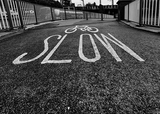 #Cycle slow, a cycle lane in the #centre of #Manchester near the #shipcanal #city #urbanliving #environmental #transport #citylife #photography #blackandwhite #streetphotography see more at darrensmith.org.uk/architecture4 #bicycle #cycling #cityriding #urbancommute