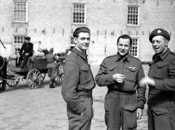 Private P. Harter of The Canadian Scottish Regiment; Private L. Hutchenson of The Essex Scottish Regiment; and Corporal P. Tedball of The Algonquin Regiment - former prisoners of war who were liberated at Leeuwarden, Netherlands, 16 April 1945. Credit: Donald I Grant.