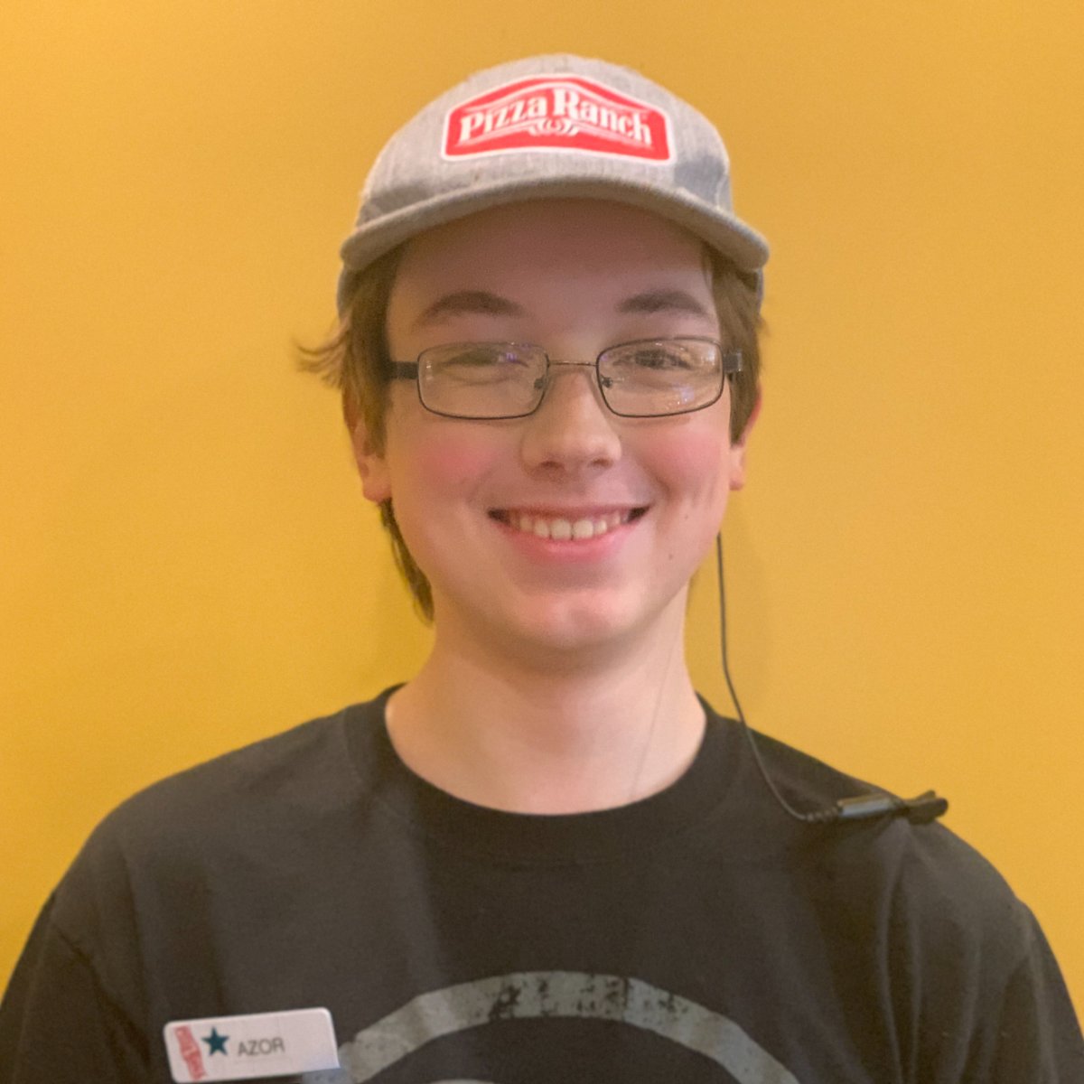 It's #TeamMemberTuesday! Meet Azor, part of our team since May. Azor dreams of launching his YouTube Channel and maybe even earning from it.

Why does he enjoy Pizza Ranch? The interactions with guests and co-workers!

His current favorite? Thin Crust BLT pizza! 🍕📺
