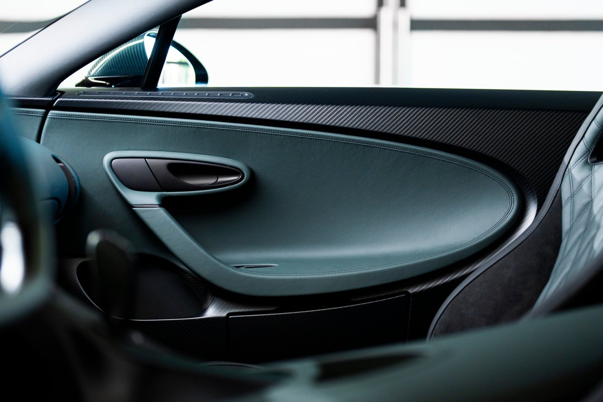 The elegant interior of this BUGATTI CHIRON Super Sport brings together 'Green' leather and 'Beluga Black' anodized carbon. 'Viper Green' details, echoing the car's sleek exterior, seamlessly perfects the exclusive design configuration. Contrasting colors come together to blend