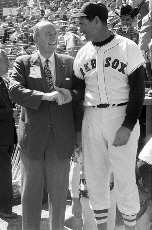 Ty Cobb and Ted Williams shake hands before a game.