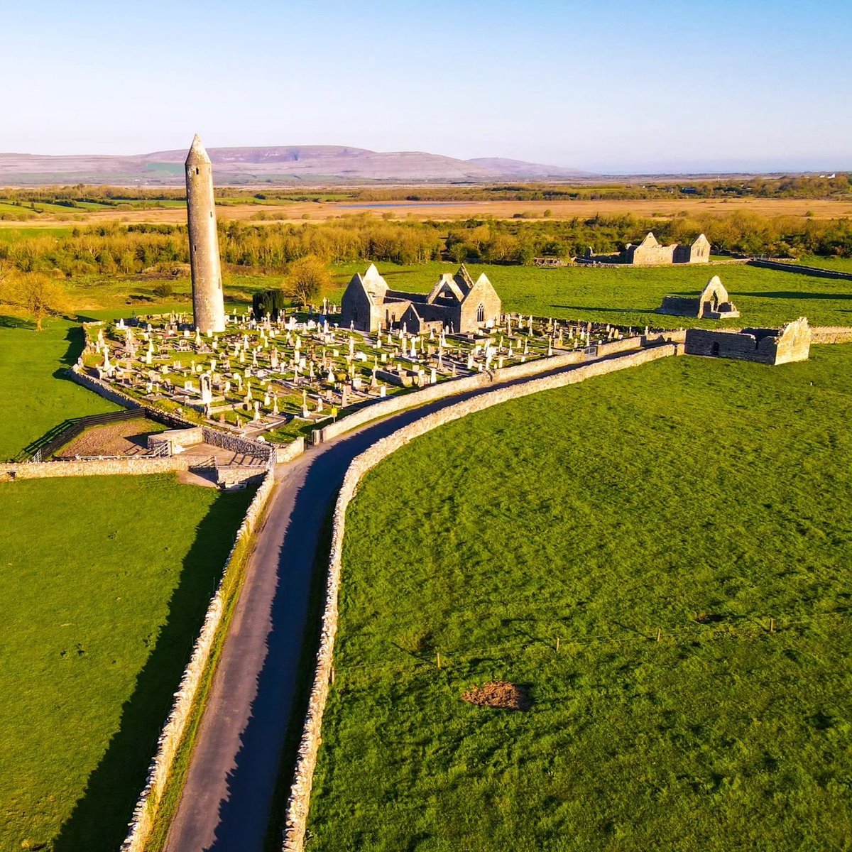 The beautiful monastic settlement of Kilmacduagh... Where its round tower, the tallest in Ireland, still stands after all these centuries! 💚 📸 IG/ skysthelimit_eire 📍 Kilmacduagh Monastery, Gort #KilmacduaghMonastery #Kilmacduagh #Gort #Galway #Ireland #VisitGalway