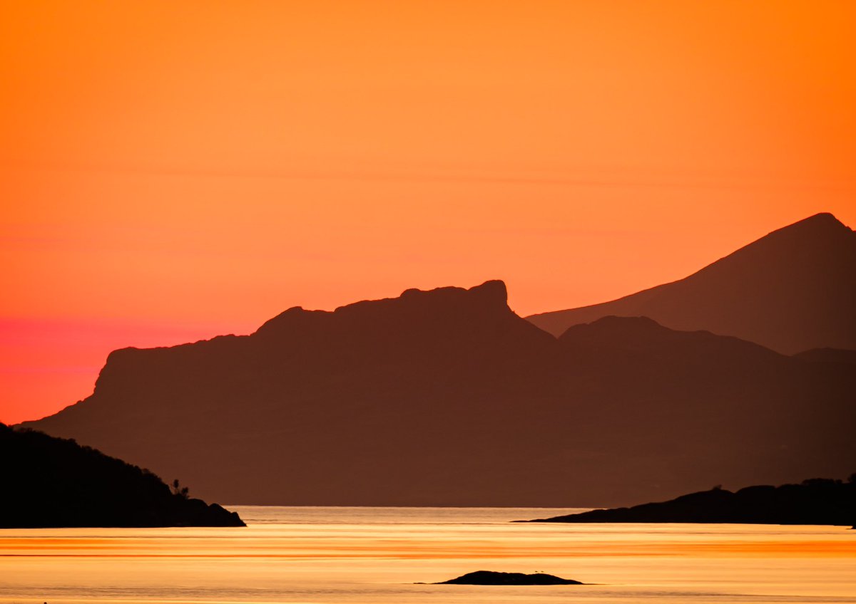 Through the Gap - Kentra Bay, Arivegaig, #Ardnamurchan   The Small Isles of Eigg and Rùm viewed through the entrance to Kentra Bay and silhouetted against the rich, warm light of the sun during one of the many rich coloured sunsets we get at this time of the year.