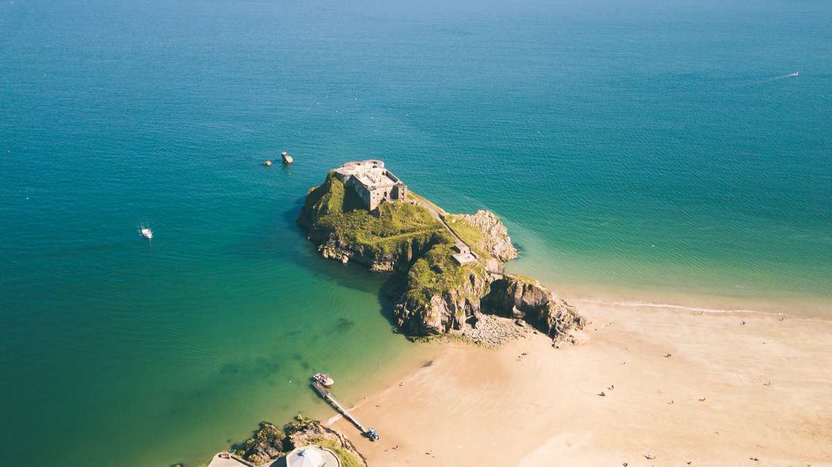 Perched majestically overlooking the turquoise waters of the Welsh coast, the ancient fortress of Tenby Castle whispers tales of battles won and lost... 📜 Feel the echoes of history all around, a true Welsh treasure. ✨