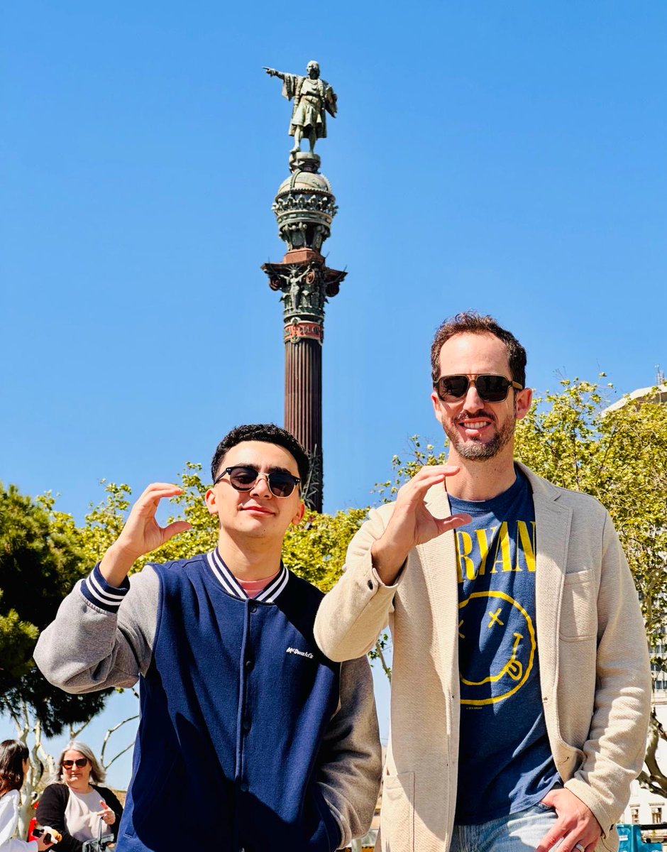 Ian A. Schuetze, Class of 2025, and his stepdad Anthony E. Cabrera, '97, representing CPride at the Christopher Columbus Statue in Barcelona, Spain! Keep the CPride spirit strong, wherever you go, Explorers! #CPride #Adelante