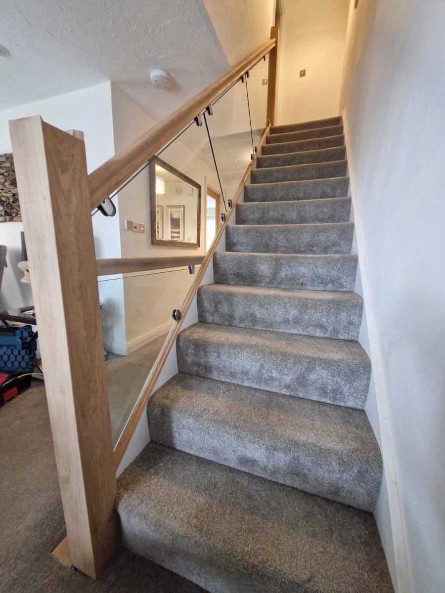Fantastic installation of 10mm toughened clear glass and mirror-polished stainless steel glass clamps to these stairs in Combe Martin Surveyed, drawn & Installed by our Barnstaple team. #glass #installation #balustrade #fitters #installers camelglass.co.uk/architectural-…