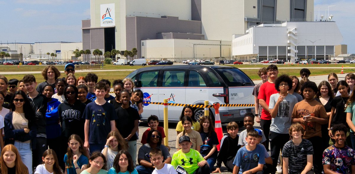 Students from Andrew Jackson Middle School in Titusville, FL, pose for a photo with one of the Artemis crew transportation vehicles from @Canoo. GOEV!
