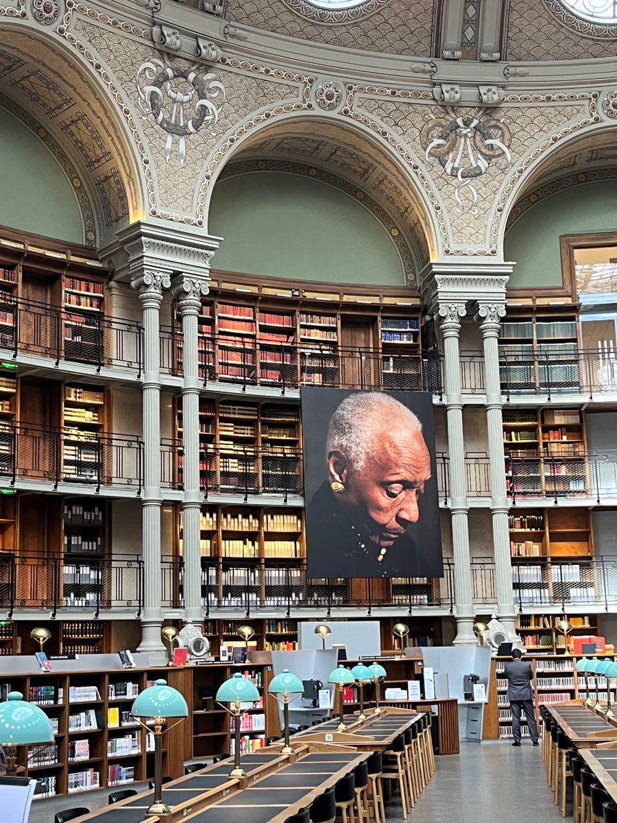 French President Emmanuel Macron honored Maryse Condé with a tribute in the newly restored Salle Ovale of the National library yesterday.