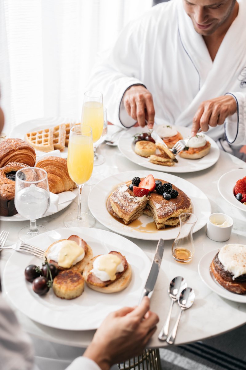 Your essentials for a perfect Eggs Benedict Day celebration are all set: cozy robes, comfy slippers, and poached eggs cooked to perfection. Let's brunch, relax, and enjoy the laid-back vibes. #NationalEggsBenedictDay