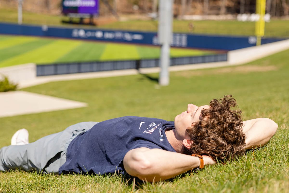 First few warm days in Storrs calls for an Elliot Ballpark tanning sesh while cheering on @uconnbsb 😄 Head to the lawn today at 6 to support your fellow Huskies!!