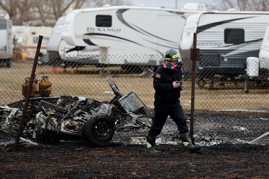 A fire investigator works at the scene of a fire east of 158 Avenue and 34 Street, as crews continue to search for hot spots Tuesday. #yeg