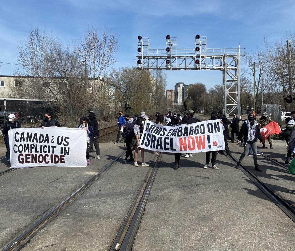 Happening right now: Palestine solidarity protesters are blocking a railway line at Osler Street and Cariboo Ave in Toronto's Junction area — they say they're planning to stay put. Demonstrators say they're responding to the international call for economic disruption. #Gaza