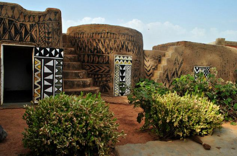 Houses of the Kassena people from Burkina Faso and the Northern Ghana border these houses date back to the 15th century they have a distinct symbol-laden painted walls creating a unique look.