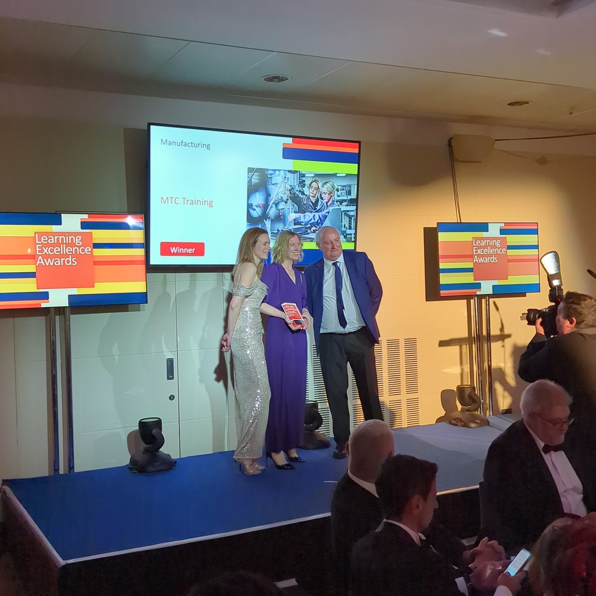 LEAwardsUK's tweet photo. Taking home the WIN for ‘Manufacturing’ is @_MTC_Training A huge round of applause to you all! #LEAwardsUK https://t.co/xjO2JTGA47