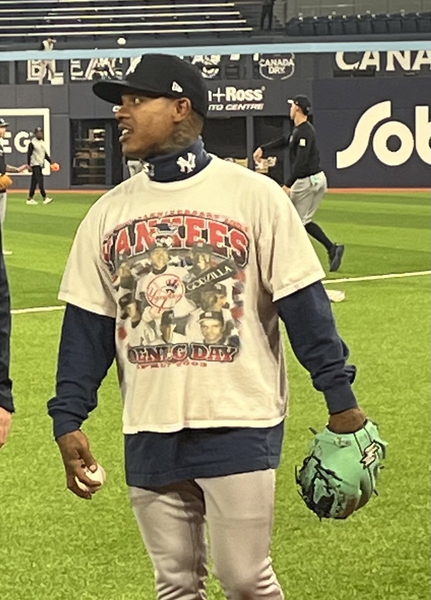 BryanHoch's tweet photo. Marcus Stroman (@STR0) with some new (old) vintage gear. It’s Opening Day 2003 again, with a Starter Yankees mock turtleneck: https://t.co/yntv316j01