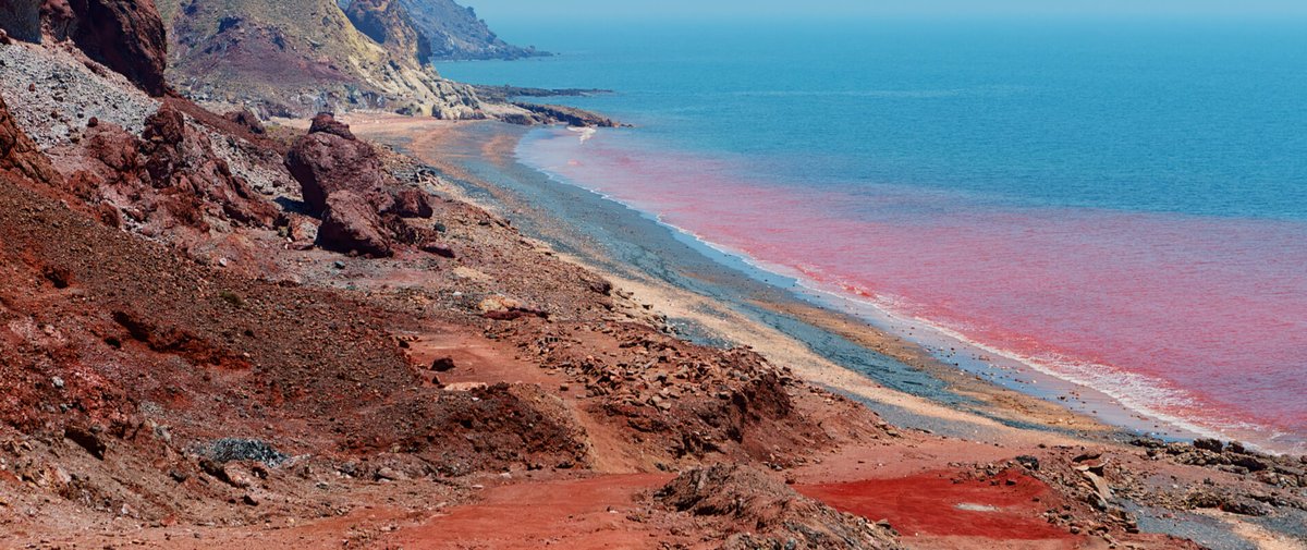 Hormuz, is an Iranian island facing the entrance to the Persian Gulf. Abundant deposits of iron oxide in the sand layers results in runoff and outflows that make the beach look blood red. It was like this for millions of years before the bible was written.