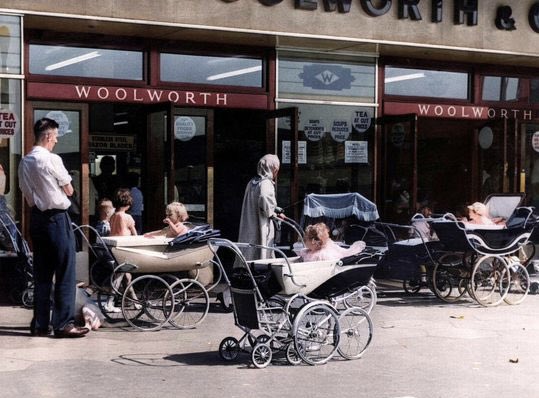 Prams parked outside Woolworth while mums shopped. Kirkby, Merseyside, in 1964.