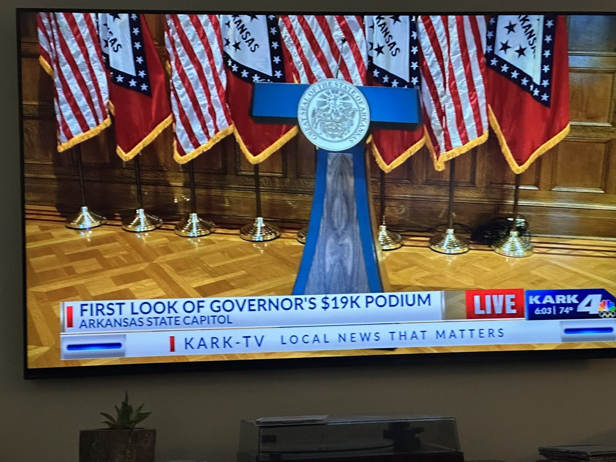 Am I the only one that sees two different lecterns?  The previously released photo shows the wood trim to be brown. The “live shot” on KARK’s News shows the lectern wood to be gray. Seems suspicious to me.