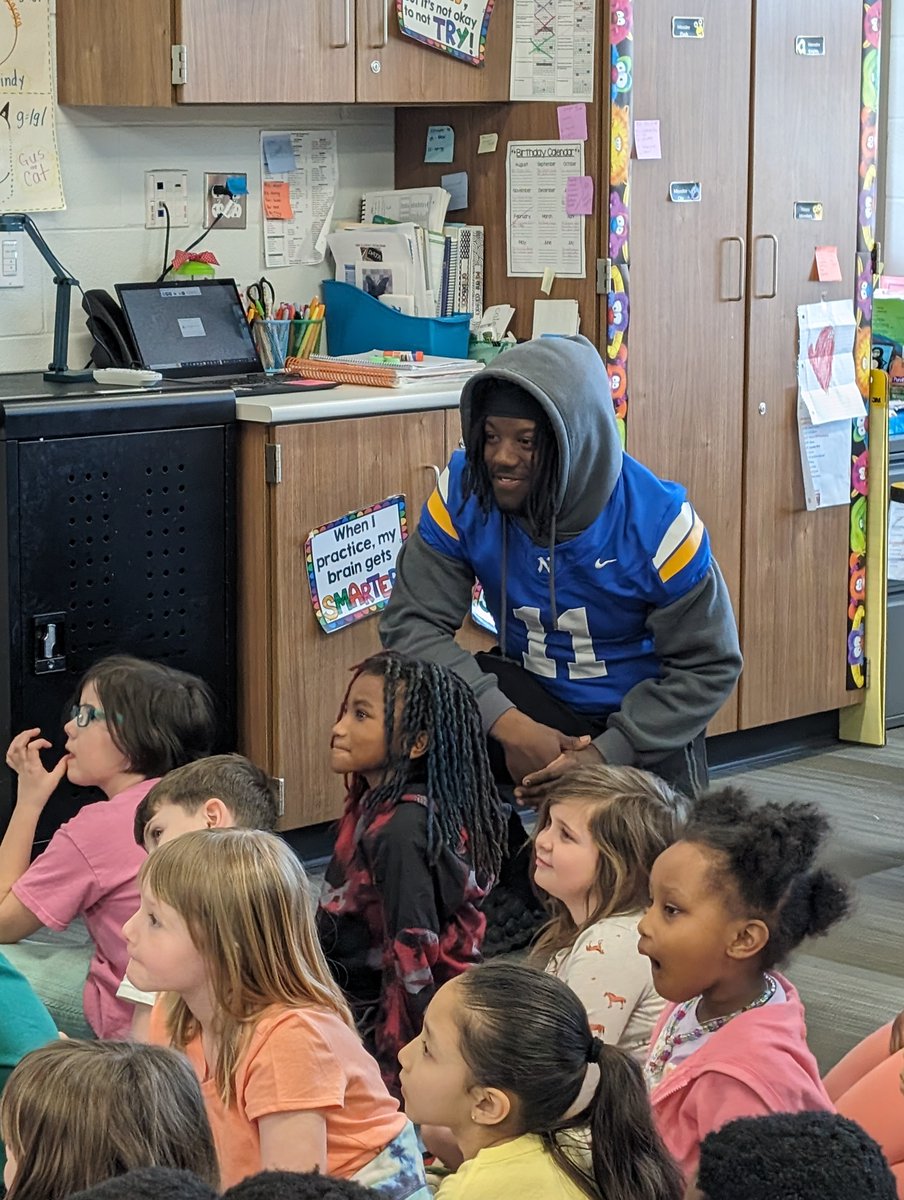 PREPRIDE's tweet image. First-grade students really enjoyed their Mystery Readers!  Some Northwest High School football players read some books to the students.