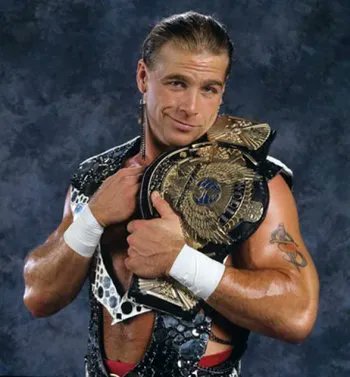 Posting these photos of The GOAT Shawn Michaels holding his belts. For no reasons at all👀