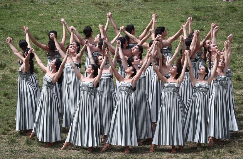 Inspired by Greek architecture, Mary Katrantzou  designed these dresses to  emulate Doric, Ionic and Corinthian columns for the lightning of the flame for the 2024 Paris Olympics in Olympia.