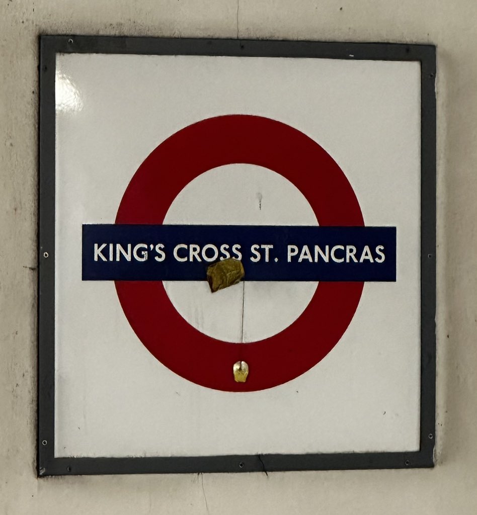 Tea bag on a Tube sign — peak London.