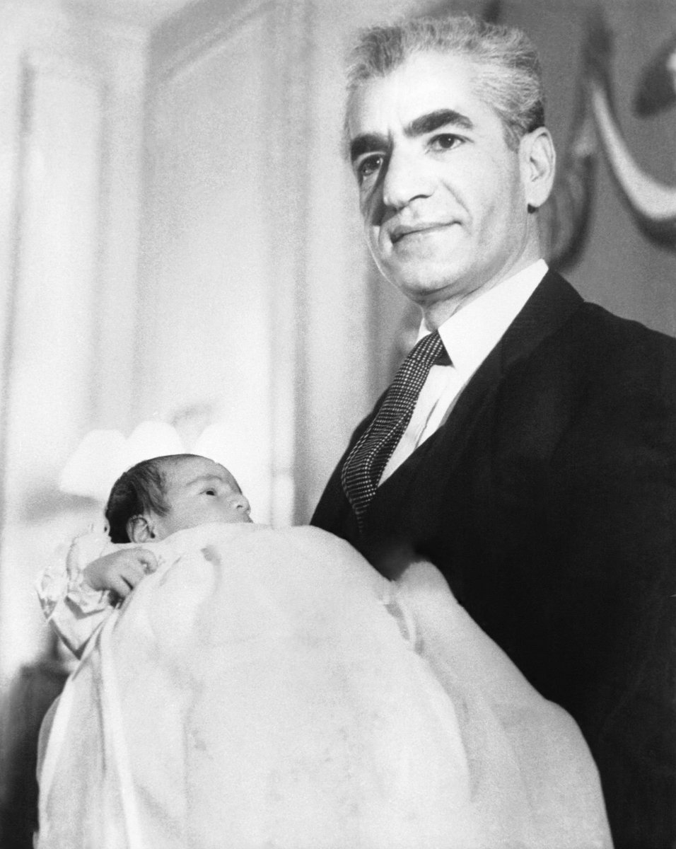 Year 1960: King Aryamehr holding Irans future in his arms. King Cyrus Reza Pahlavi. <hi-res image> #KingRezaPahlavi #FreeIran #MahsaAmini