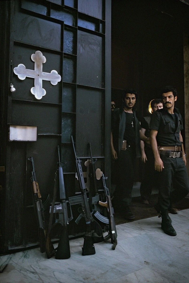 Christian Fighters of the Lebanese Forces exiting an orthodox church during the civil war, late 70s.