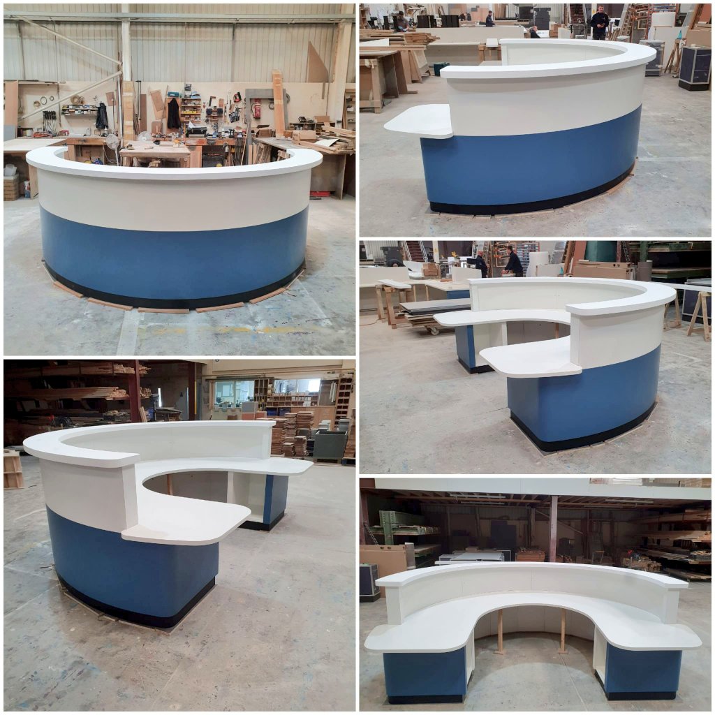 Laminated Reception Desk with Corian Glacier White raised console.