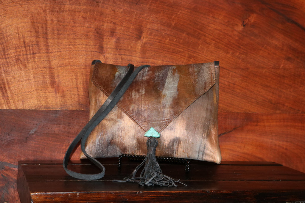 Patina Handpainted Crossbody Bag  Saddle up and transform your home with authentic western or rustic vibes. shortlink.store/8w5nhyipum6e 
#WesternPassion #WesternFurniture