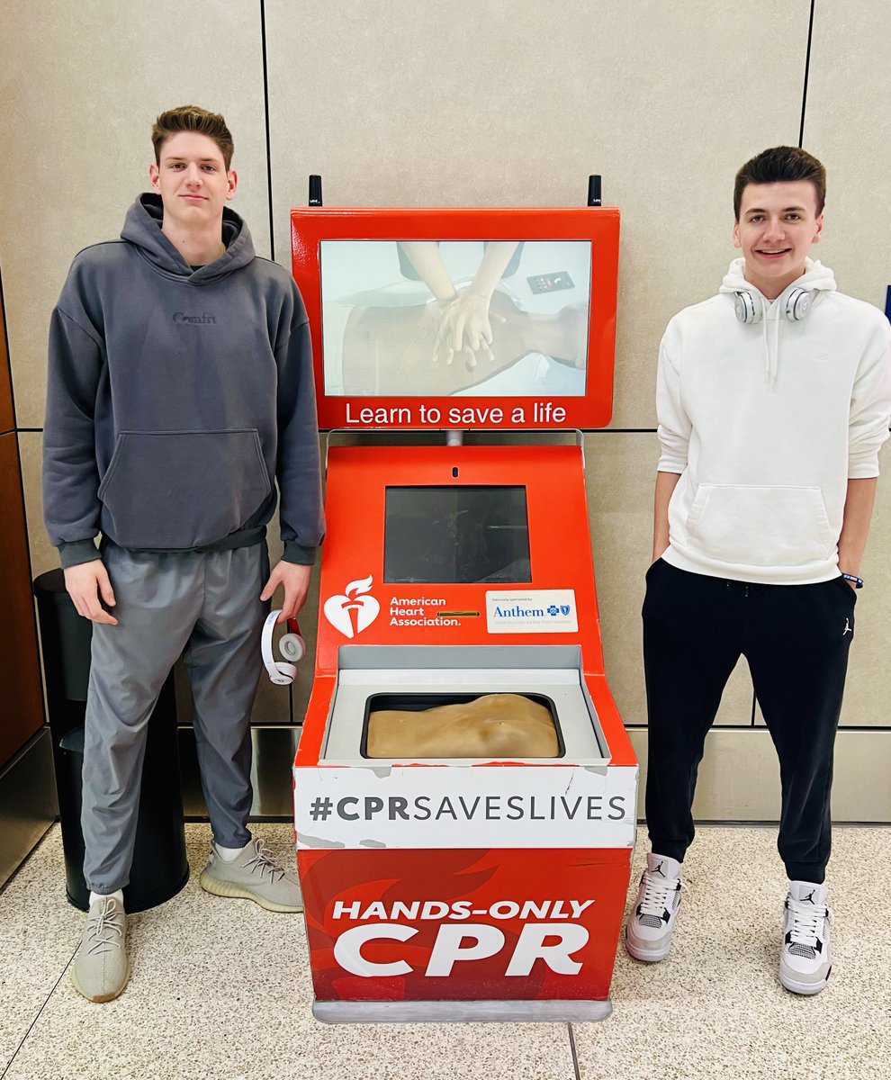 AHAIndiana's tweet photo. Teen cardiac arrest survivor Jake Chapman, left, checks out the @American_Heart Hands-Only CPR kiosk at @INDairport with his brother. Jake's Michigan family has championed CPR education since he collapsed in his kitchen last fall. #NationofLifesavers #CPRSavesLives #ChapmanStrong https://t.co/TjIqzwXOFH