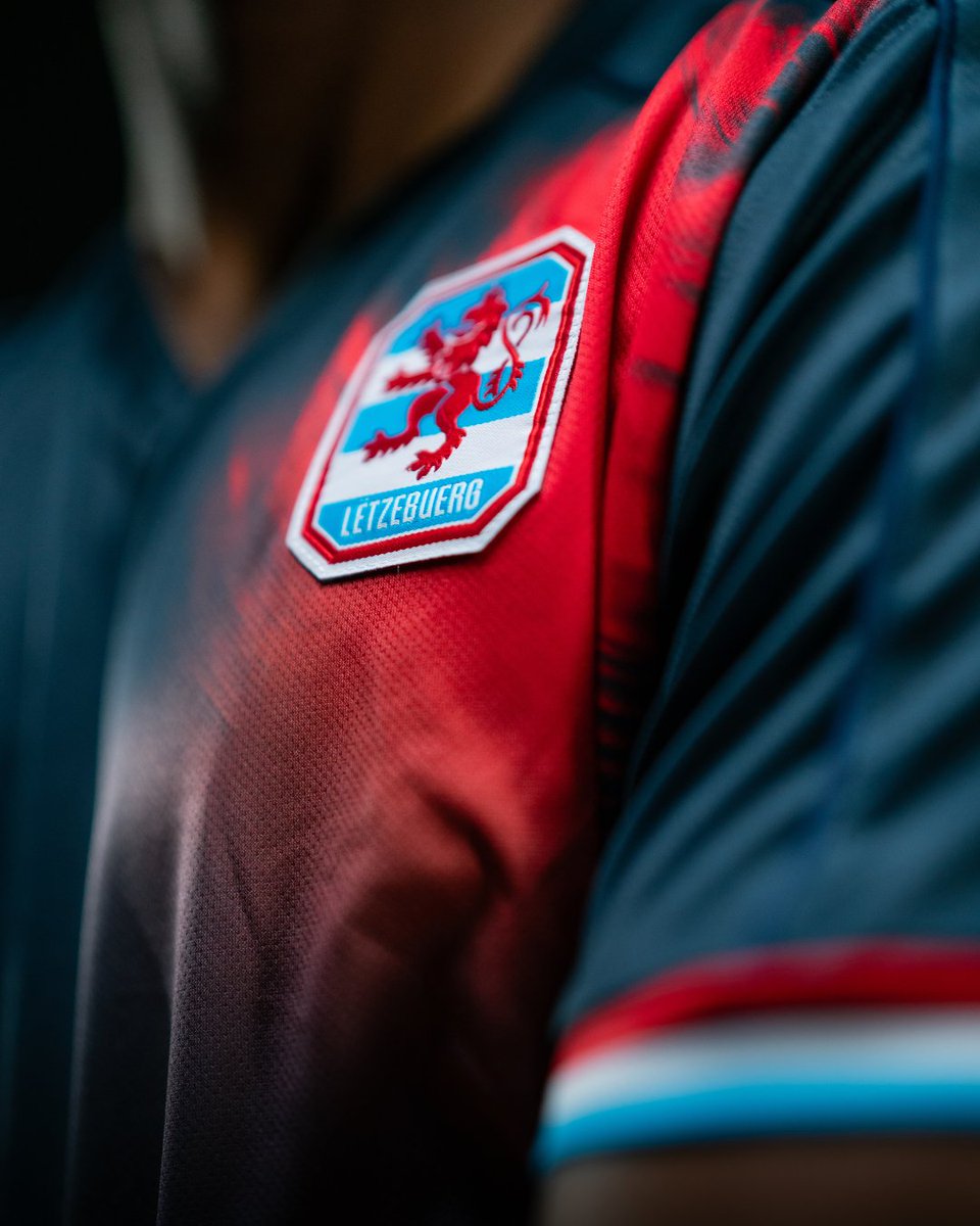 Off the back of yesterday's home shirt reveal, we now also get a look at Luxembourg's away kit & it's arguably the better of the two designs! The country's red lion emblem fades out in red and blue against a navy base. Ooft, that flag trim on the cuffs 🇱🇺👌 #TeamRoudeLéiw