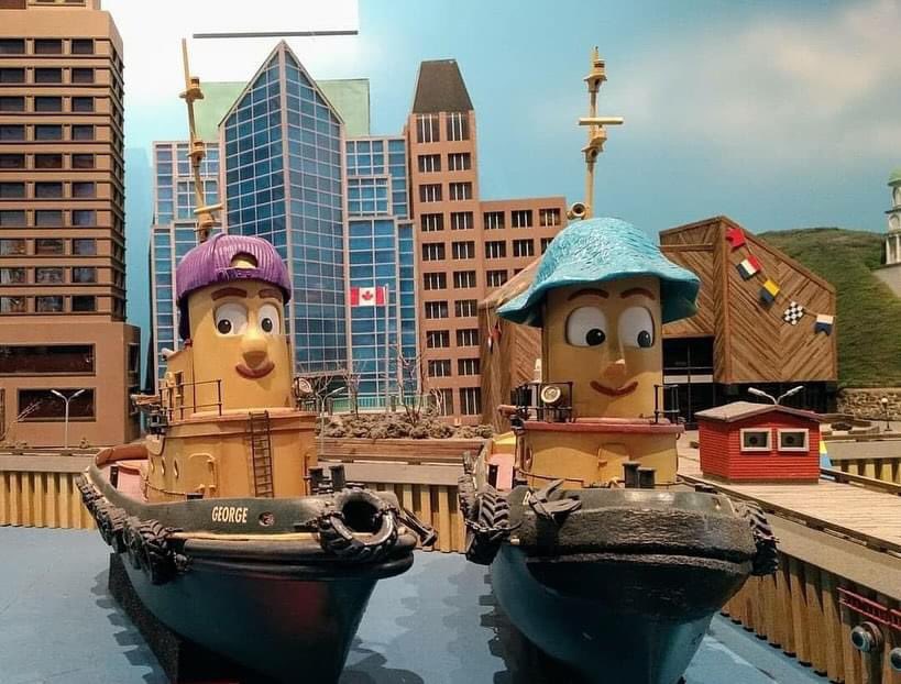 We’re so glad Friendly Giant, and Assistant Curator of Marine History, Amber Laurie can reach the tops of all the tall buildings around the Big Harbour at the Maritime Museum of the Atlantic to keep them ship shape for Theodore Tugboat and friends.