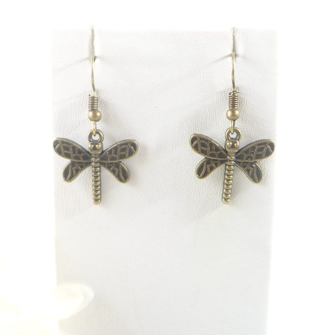 Bronze Dragonfly Earrings. Embrace the whimsical charm of nature with these enchanting Dragonfly Earrings, crafted in bronze for a minimalist yet striking appeal. buff.ly/4d3zKyD  #salejewelry #NewMexico #etsyshop #shopsmall #wiseshopper