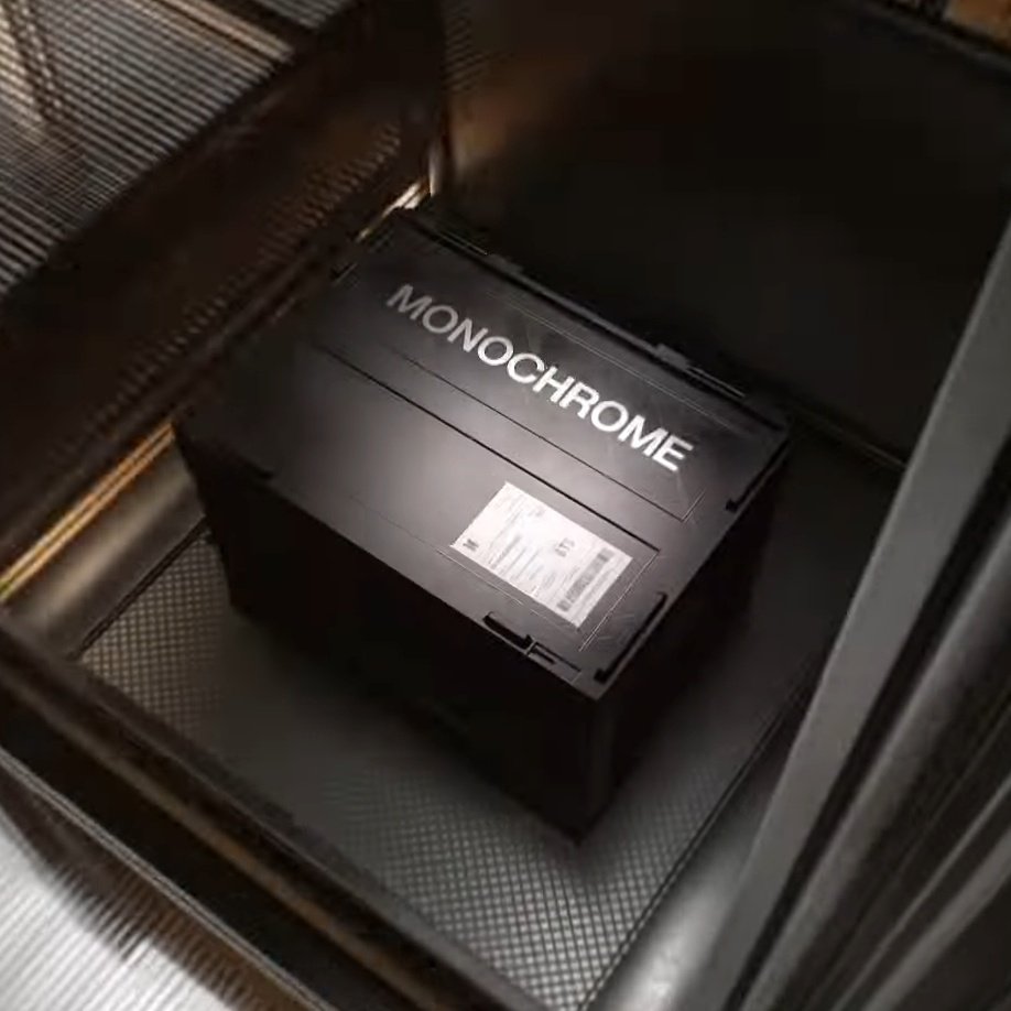 I need to know WHY it's called monochrome and what's in that box if it's abt pop up store