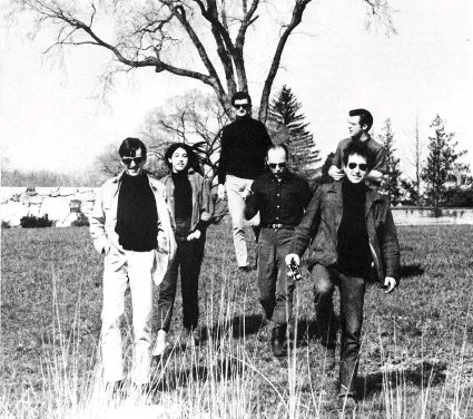 Bob Dylan walks on a meadow with Charlie Frizzell, (possibly) Mimi Fariña, Victor Maymudes, Paul Rothschild and John Sebastian, Amherst, Massachusetts, 1964. 📸: John Byrne Cooke. #BobDylan #Dylan