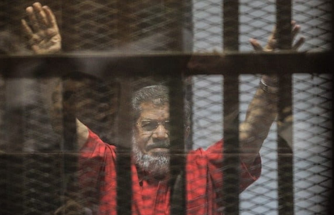 Mohamed Morsi behind a glass cage, does this remind you of something?  

This is what Asim Munir has done to Imran Khan.  

Asim Munir is unleashing the Egyptian and North Korean model of tyranny all over Pakistan after unleashing it in Balochistan and KP for the past 75 years.