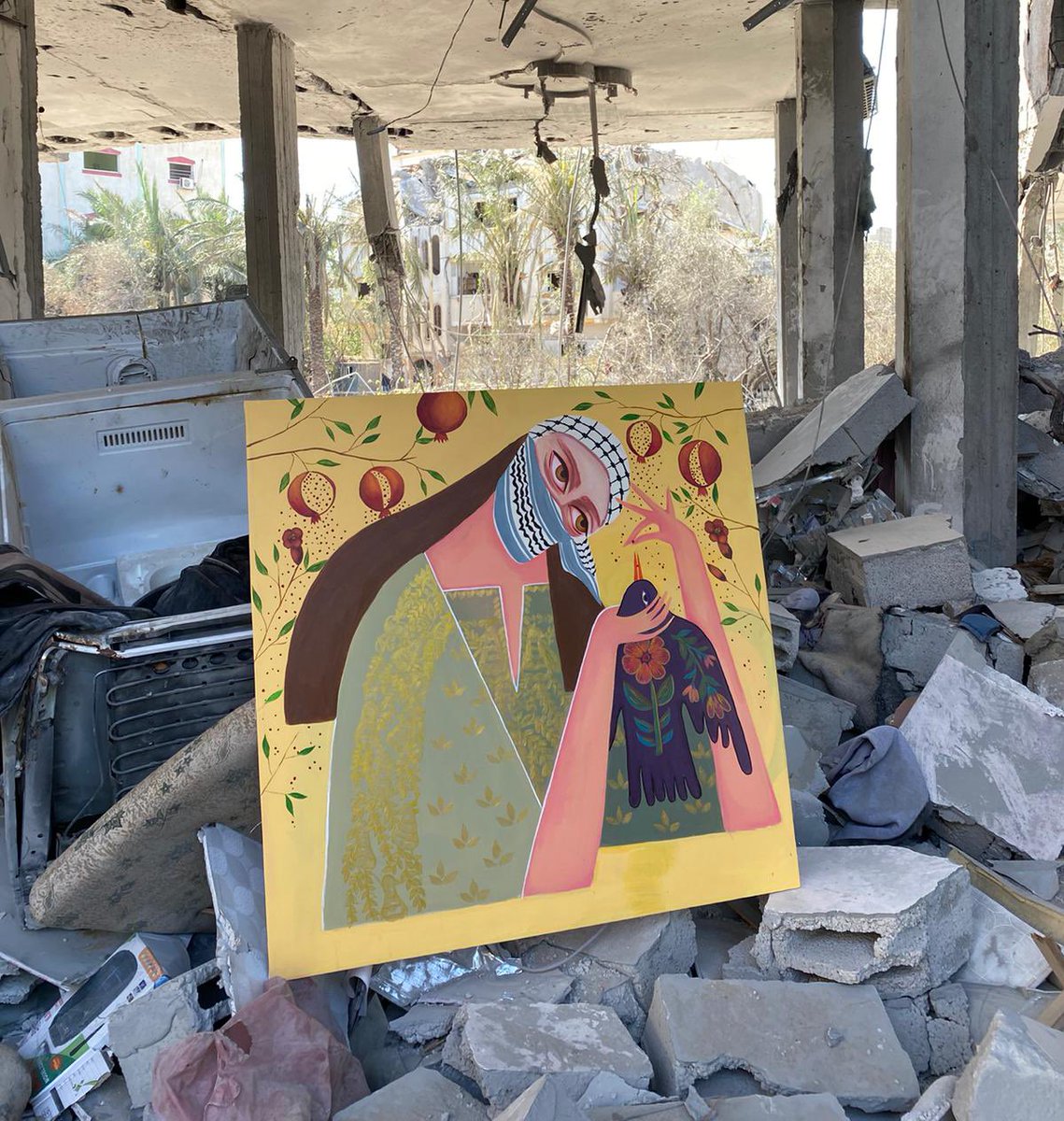 Artist Asmaa AlJueithni shares picture of the only thing that survived a destructive strike on her home in Gaza that left it in ruins: one of her paintings.