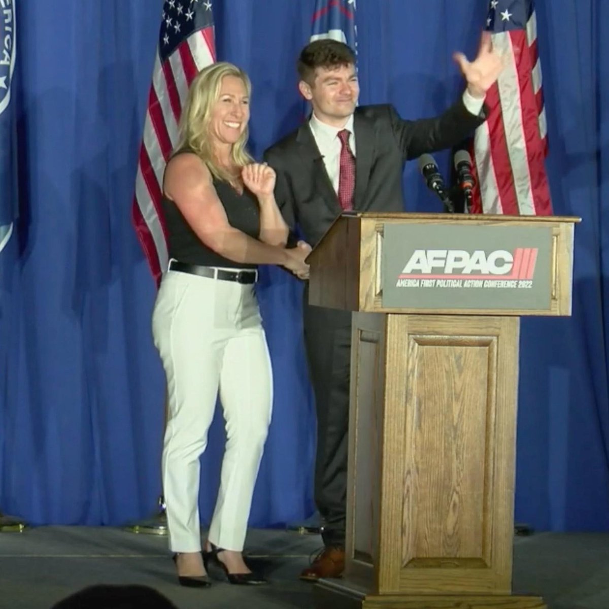 Here is Marjorie Taylor Greene shaking hands and speaking at an event with an avowed neo-Nazi and white supremacist