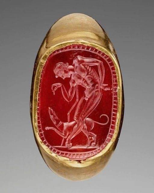 Roman Engraved Gem (Carnelian) with a Youth and his Dog inset into a Hollow Gold Ring (3rd-2nd Century BC), from Italy : The engraving of gemstones was a major luxury art form in the ancient world, and has been revered throughout history. From as far back as 5000 BC right up to…