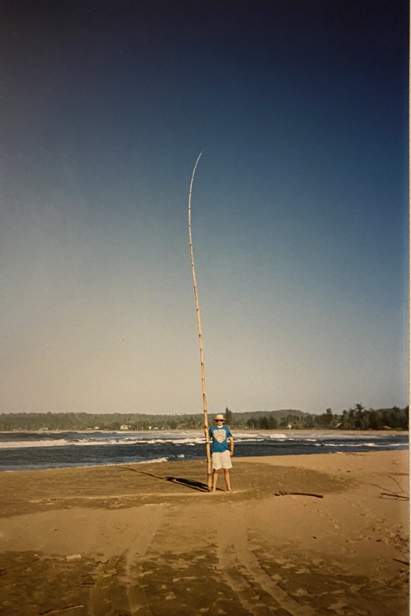 OTD 10 years ago on the beach at Hanalei.This bamboo pole find kept John entertained for hours!