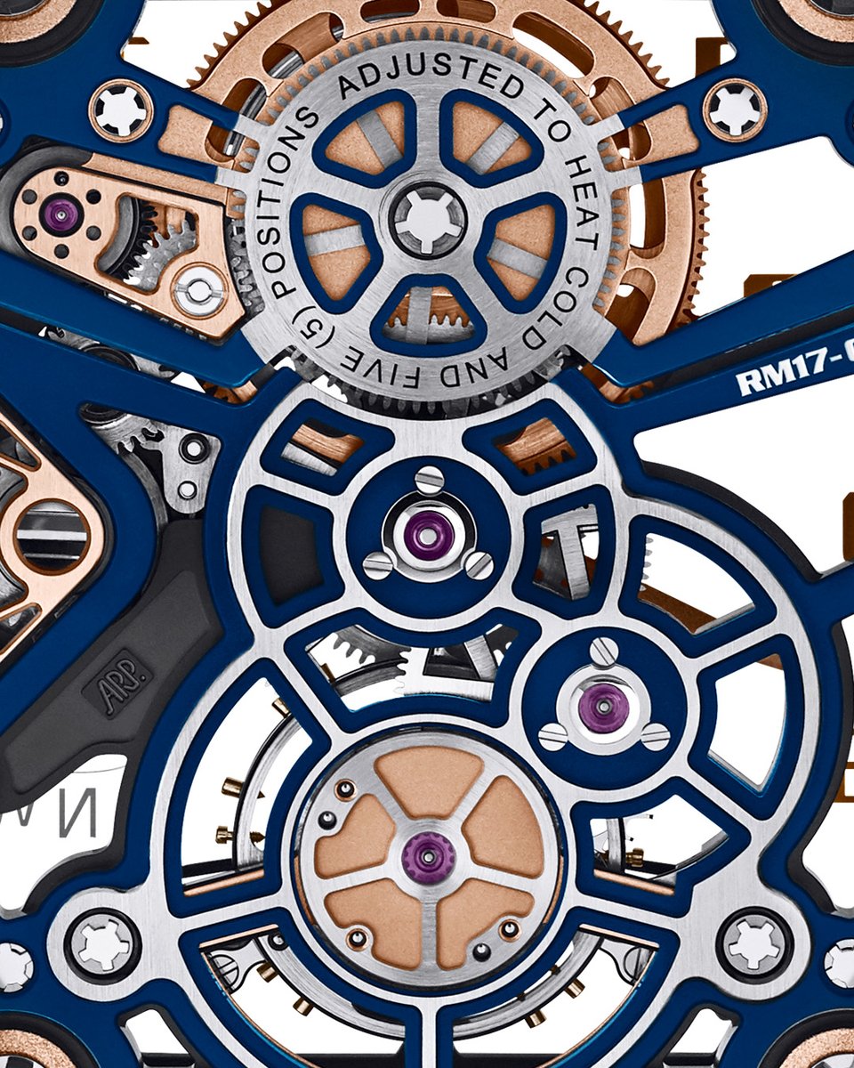 The RM 17-02 Tourbillon in Quartz TPT® mesmerizes as its movement dances with light. A symphony of blue, gold, and black PVD treatments intertwine with the titanium microblasted surfaces of the skeletonised baseplate, casting a spellbinding allure. bit.ly/3tzzmlP