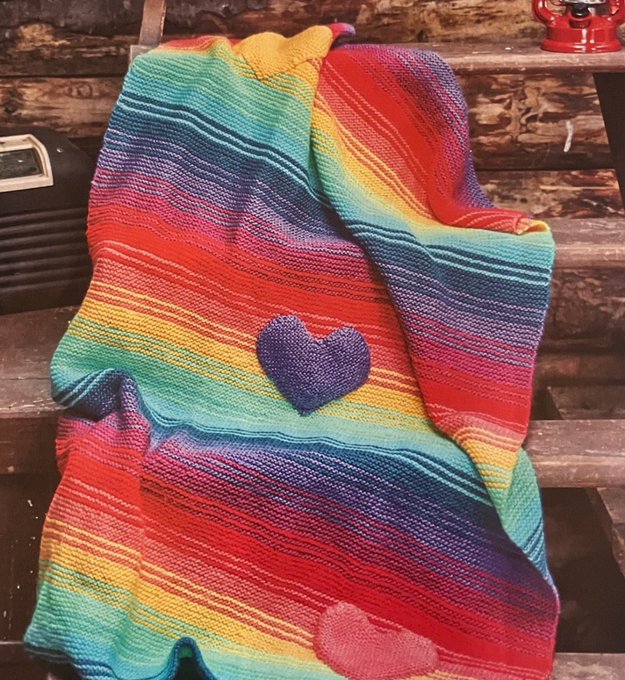 Rainbow Knitted Throw ❤️🌈 Featuring heart motifs. This pattern is perfect for creating a cosy blanket to wrap your loved ones in warmth and love. With vibrant colours and charming hearts, it will add a wonderful touch to any home 😊 #MHHSBD #craftbizparty #rainbows